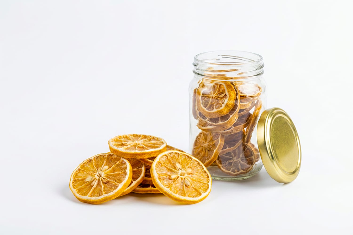 Salt fermented dried lemon slices with a glass jar